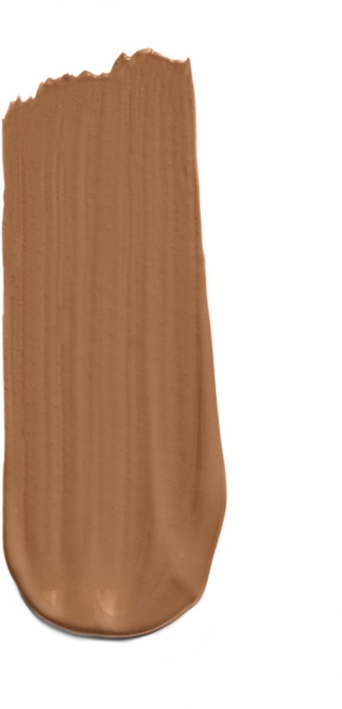 En prøve av beige farget flytende kosmetikk, muligens foundation eller concealer, på hvit bakgrunn.