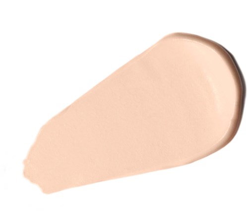 Beige-kermainen tai -voide-levy valkoisella taustalla, pyöreällä reunalla ja kiiltävällä pinnalla.