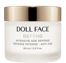 A white jar with a gold lid labeled 'DOLL FACE' for skincare, with additional details about the product.