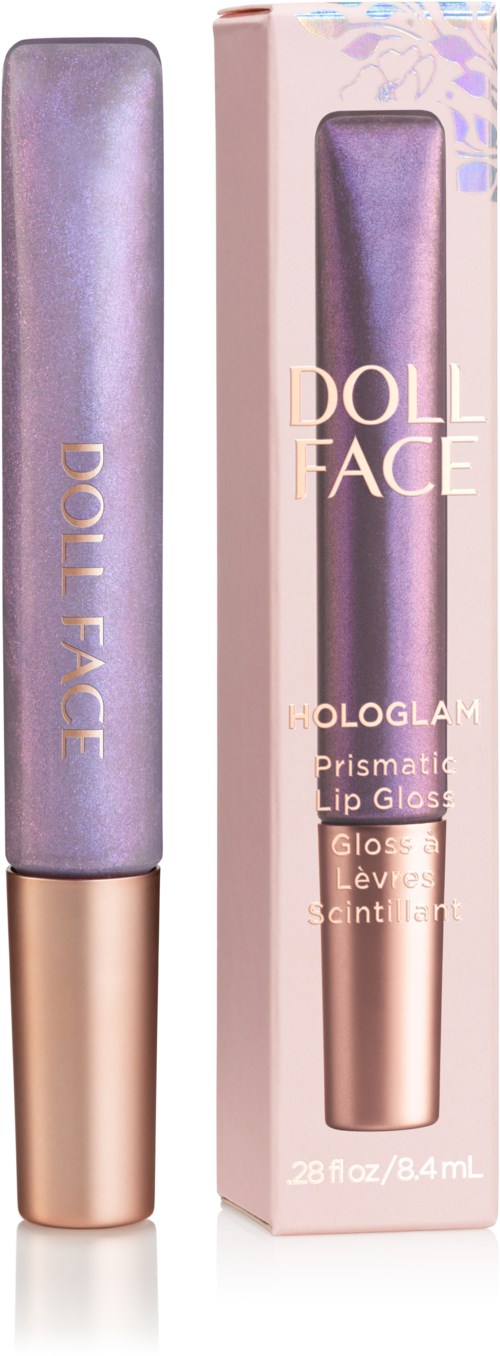 Leppeglans i lilla tube og eske, merket Doll Face, med skinnende overflate og gullhette.