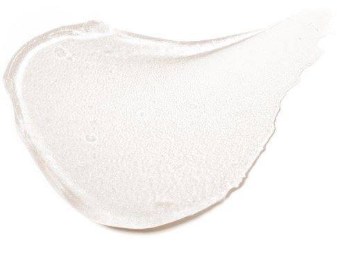 A white cream smear with smooth texture, curved shape, and slightly glossy surface.