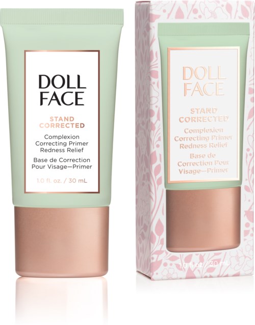 A tube of Doll Face Stand Corrected primer with packaging; both have pastel green and pink colors, and someone printed text.