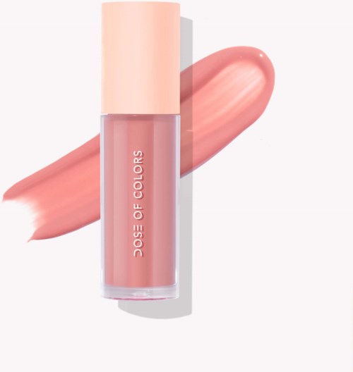 A lipstick tube labeled 'Dose of Colors' with a peach-colored cap, and a swatch of peach lipstick beside it.