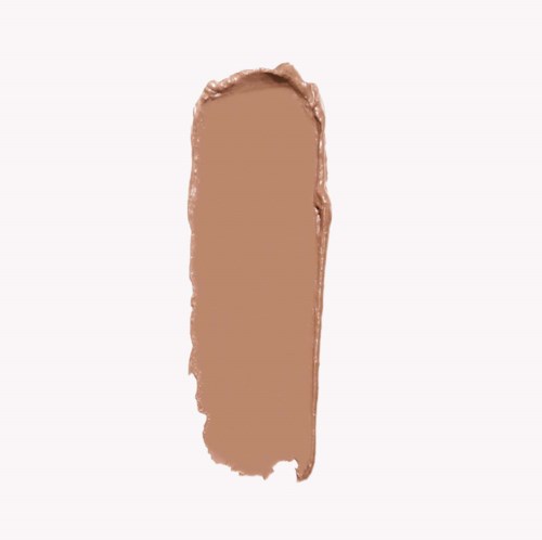 A smear of light brown makeup or paint on a white background, oval shape with rough edges.