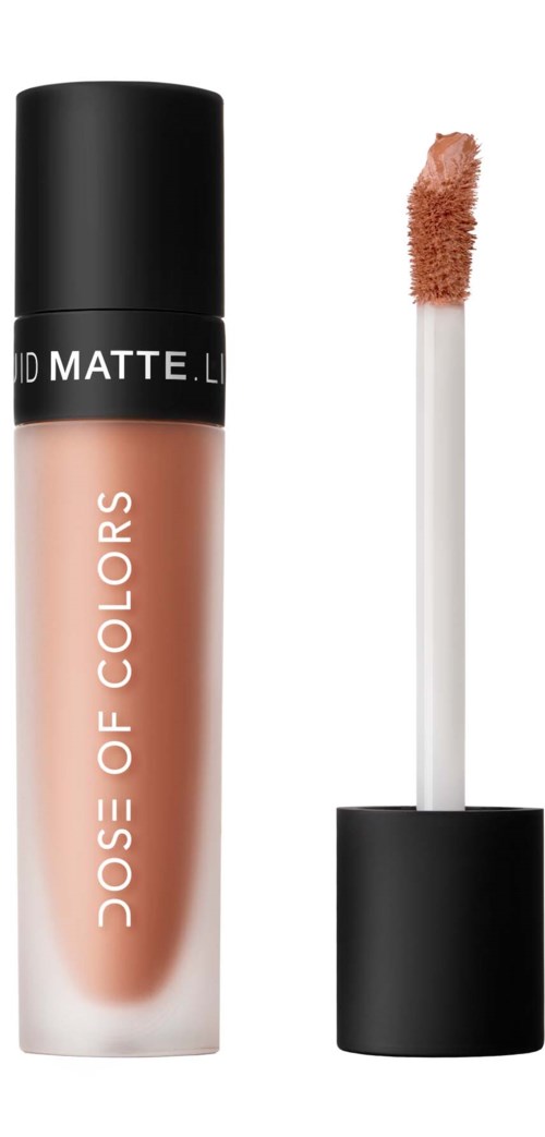 A nude liquid lipstick in a frosted glass tube, with a black cap and an applicator brush beside it.