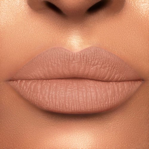 Close-up of full, smooth lips and part of nose with soft skin tone.