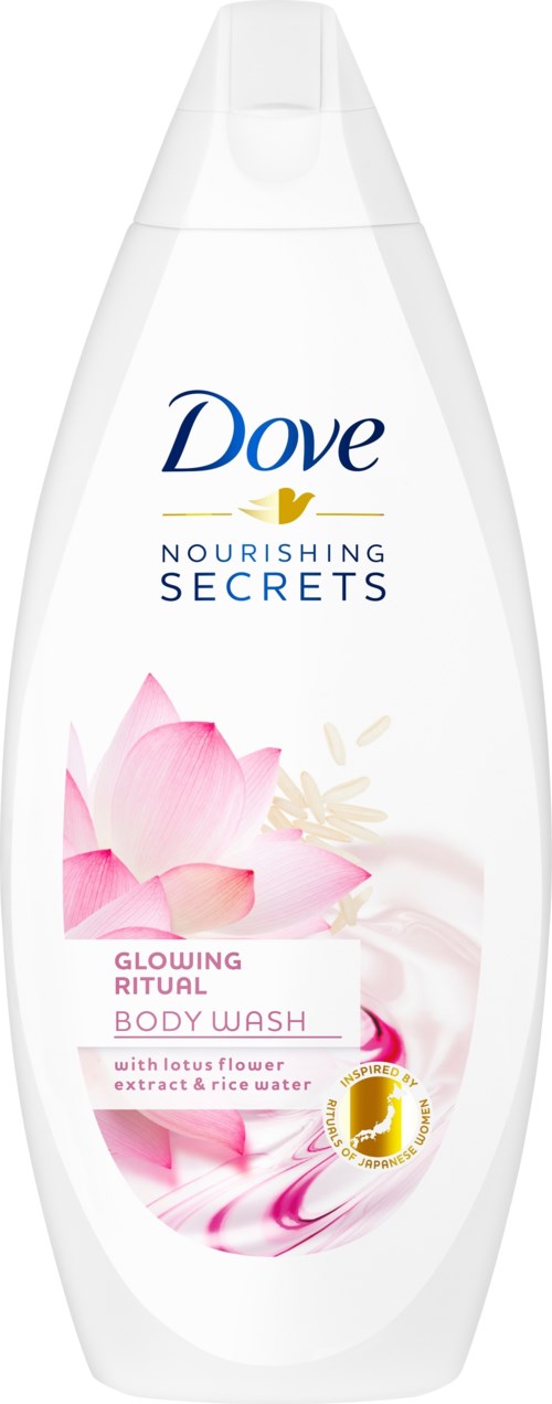 En hvit flaske med Dove kroppsvask med bilde av en rosa lotusblomst og blå, gul og rosa tekst.