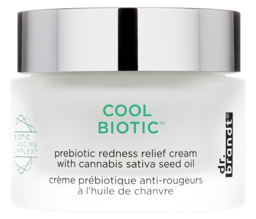 A jar of Cool Biotic prebiotic redness relief cream with cannabis seed oil and silver lid.