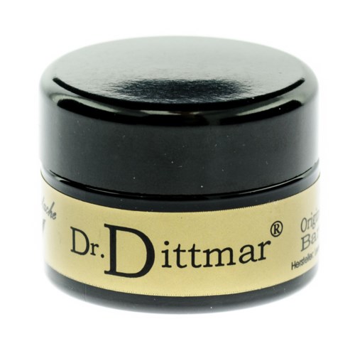 En liten svart burk märkt 'Dr. Dittmar' med ett beige band runt den.