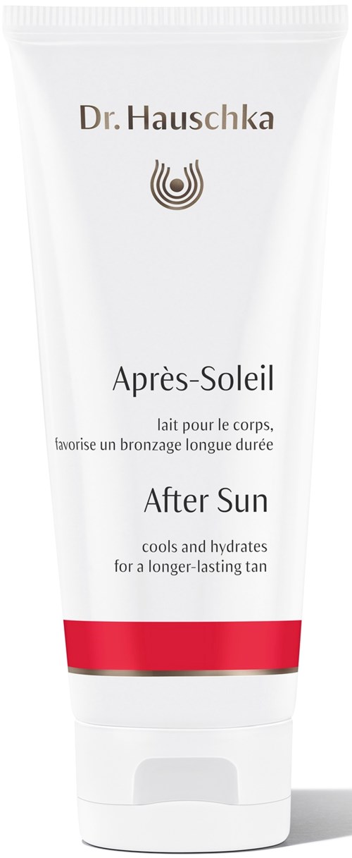 En vit tub med after sun-lotion med röda och gyllene detaljer, märkt 'Dr. Hauschka' och 'Après-Soleil' för ett hållbart solbrända resultat.