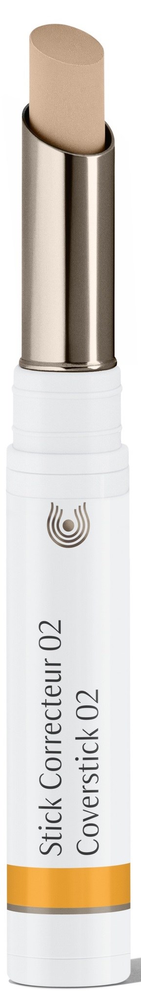 En beige sminkkorrigerende stift med sølvhette og hvit kropp, merket "Stick Correcteur O2 Coverstick O2."