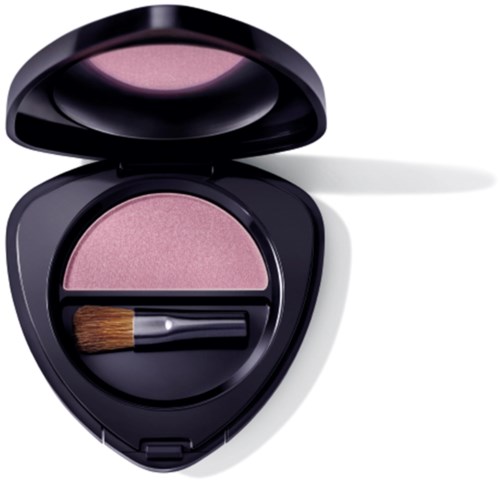 En rosa rouge med en liten borste inuti ett svart kompakt fall, öppet för att visa makeupprodukten.