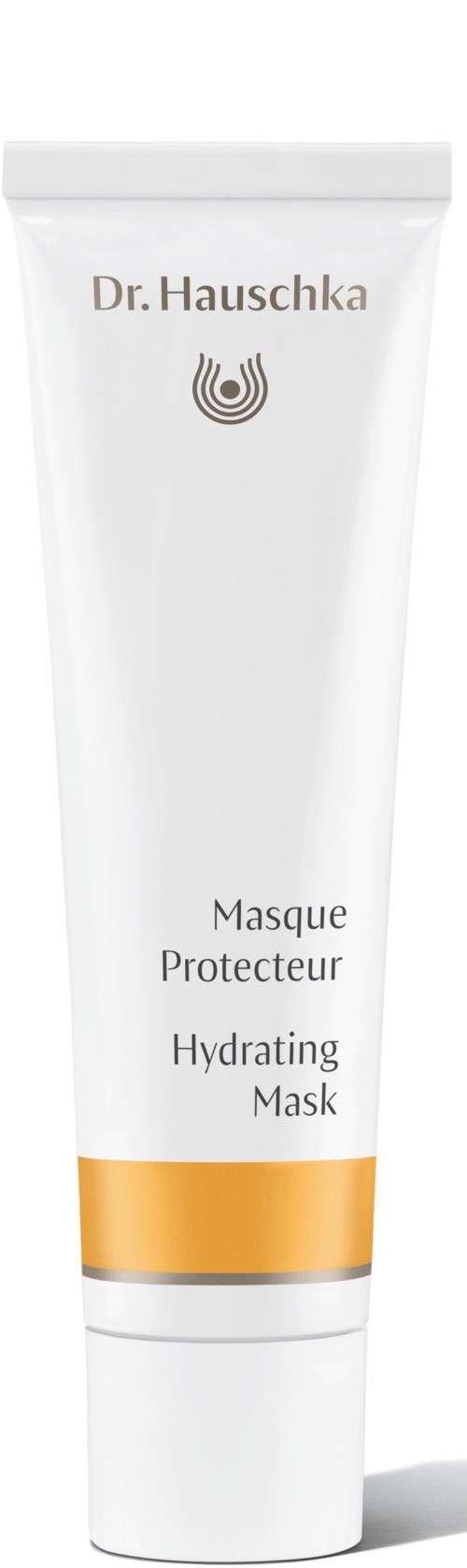A white tube with gold band, labeled Dr. Hauschka Hydrating Mask, stands upright.