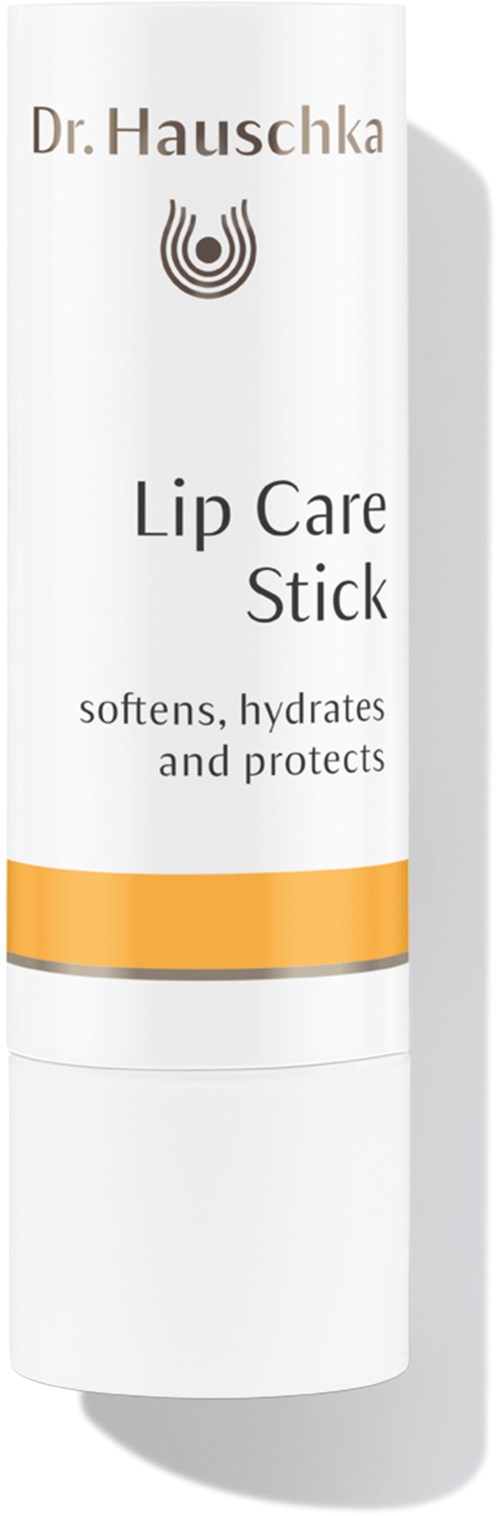 Een witte tube met oranje band, gelabeld 'Dr. Hauschka Lip Care Stick', dat lippen verzacht, hydrateert en beschermt.
