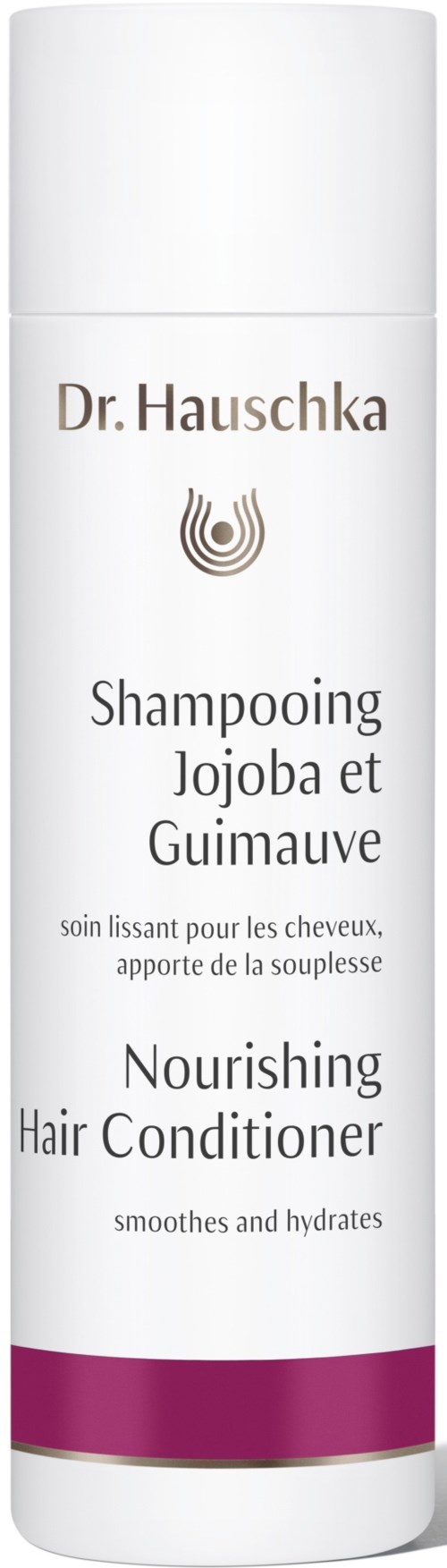 En lång vit flaska med text på franska och engelska som beskriver närande och fuktgivande balsam med jojoba och guava.