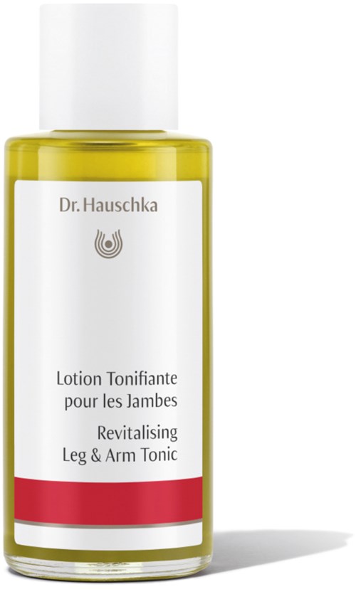 En gul flaska med vit och röd etikett, innehåller toningslotion för ben och armar, av Dr. Hauschka.