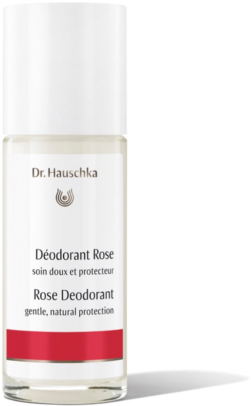 Pullossa Dr. Hauschka Rose Deodorant, valkoinen ja punainen raita, hellävarainen suoja.