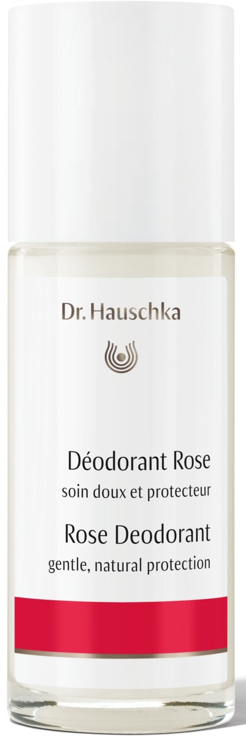En klar flaske med rose deodorant med hvid låg og rød stribe, mærket på fransk og engelsk.