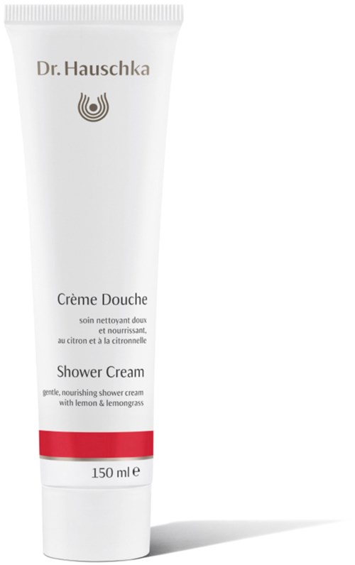 En vit tub med Dr. Hauschka duschkräm med röd detalj, märkt som närande med citron och citrongräs.