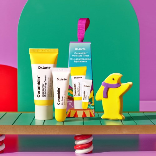 Skincare products and a yellow duck with a purple scarf on a colorful shelf.