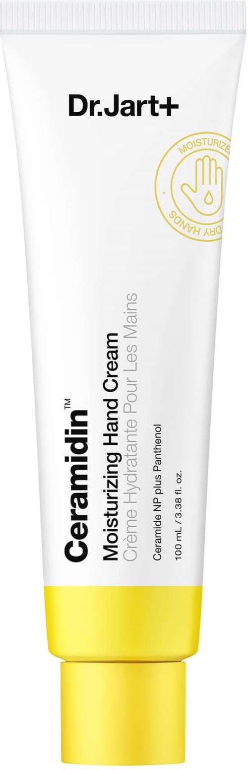 En hvid og gul tube mærket 'Dr. Jart+ CeraMidia Moisturizing Hand Cream' med tekst og en guldbesidet hånd ikon.