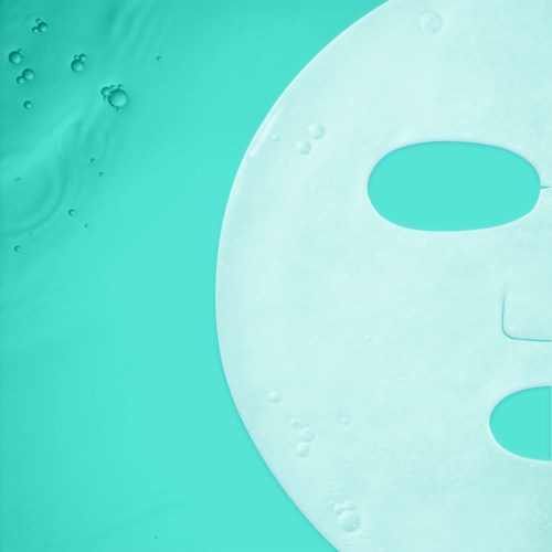 A white mask with eye holes floats on a turquoise background, with bubbles in the water.