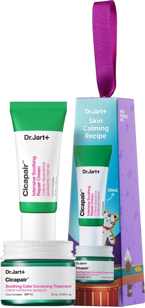 A skincare set with a tube, a jar, and a box with colorful illustrations and a purple ribbon.