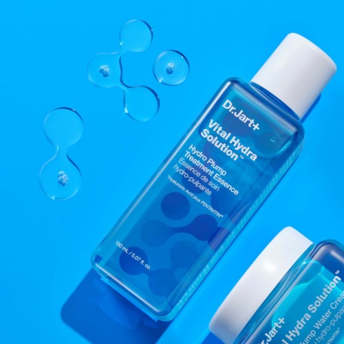A blue bottle labeled 'Dr. Jart+ Vital Hydra Solution' with a white cap, surrounded by water molecule illustrations.