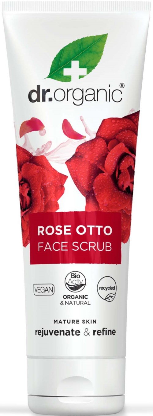 En vit tub med röda rosor, grönt blad och etikett för ansiktsskrubb av dr.organic, riktar sig mot mogen hud.