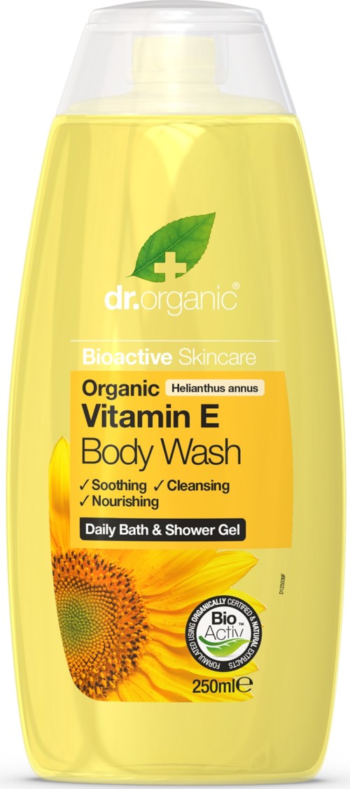 En gul flaska med Dr. Organic Vitamin E Body Wash med solrosbild, märkt för lugnande, rengöring och näring till huden.
