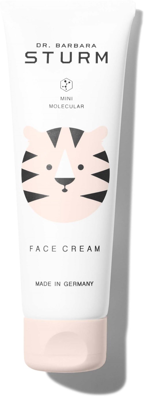En vit tub märkt 'Face Cream' med en söt tigerillustration och text som säger att den är tillverkad i Tyskland.