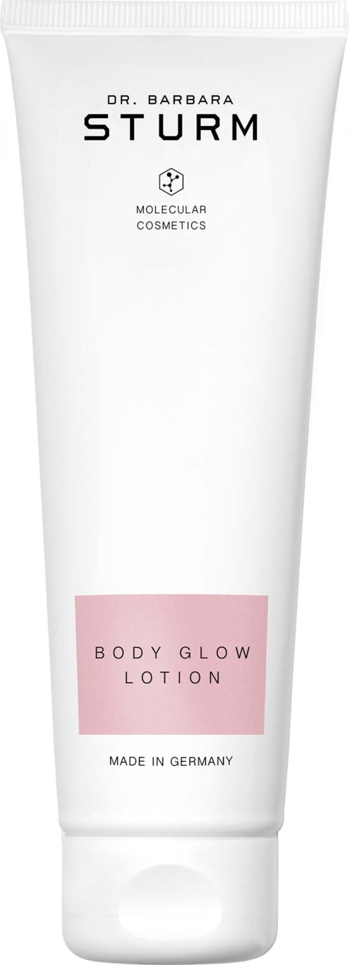 Een witte tube Dr. Barbara Sturm Body Glow Lotion met roze label en zwarte tekst, gemaakt in Duitsland.