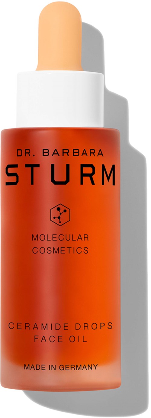 Czerwona butelka z pipetką, oznaczona 'Dr. Barbara Sturm' i 'Ceramide Drops Face Oil'. Wyprodukowane w Niemczech.