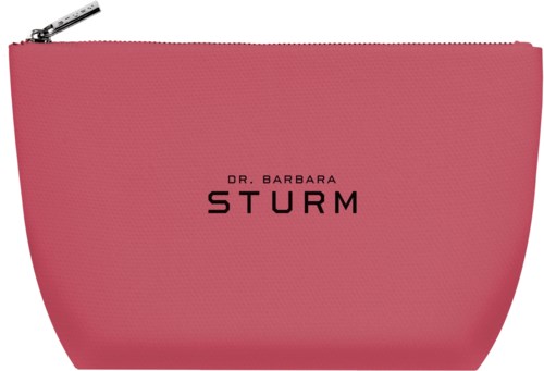 Rosa kosmetväska med svart text, "Dr. Barbara Sturm," och en silverfärgad dragkedja.