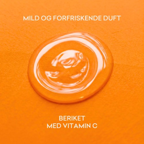 En rund sæbe med en snoet design, orange baggrund og tekst om mild duft og vitamin C.