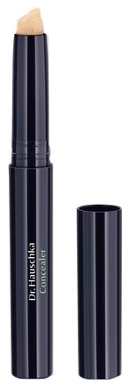 En svart concealer-penna med lock, märkt "Dr. Hauschka Concealer."