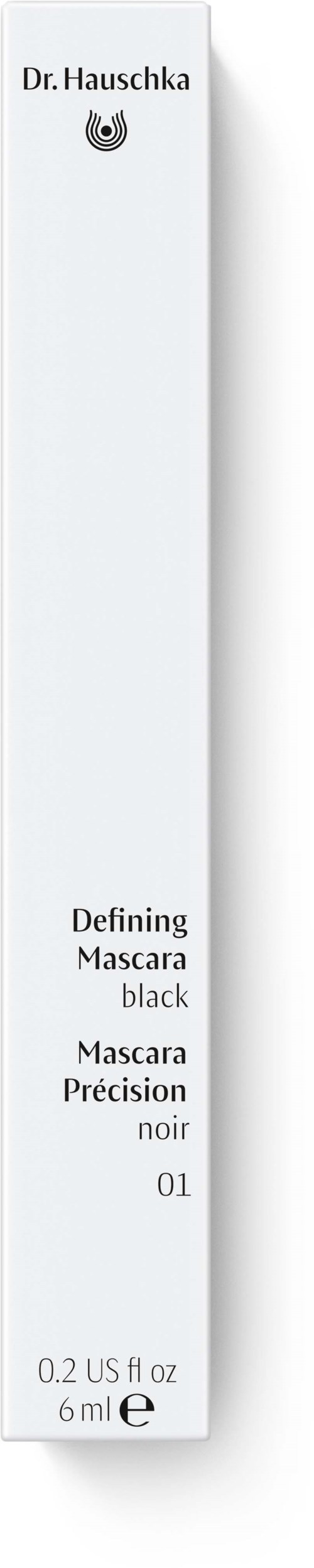 Ett vitt mascara-förpackning med svart text för Dr. Hauschka mascara,storlek 6 ml, märkt 'Defining Mascara black.'