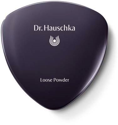 A dark purple compact with the label 'Dr. Hauschka' and 'Loose Powder' on the front.