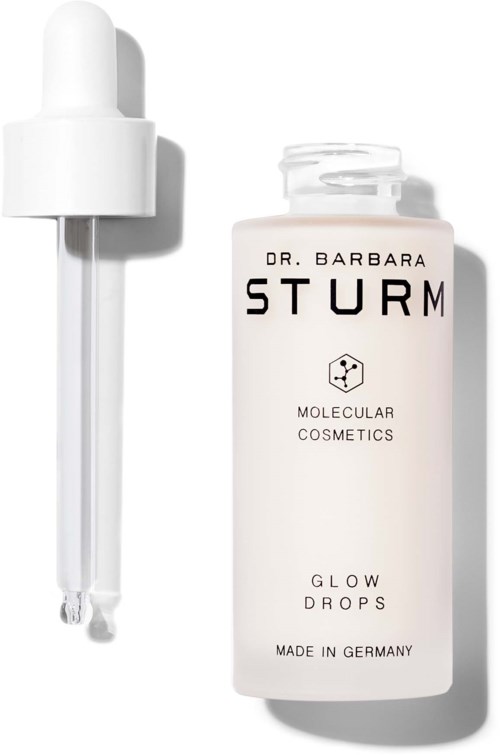 En vit flaska märkt 'Glow Drops' från Dr. Barbara Sturm med en pipett. Snygg och minimalistisk design.