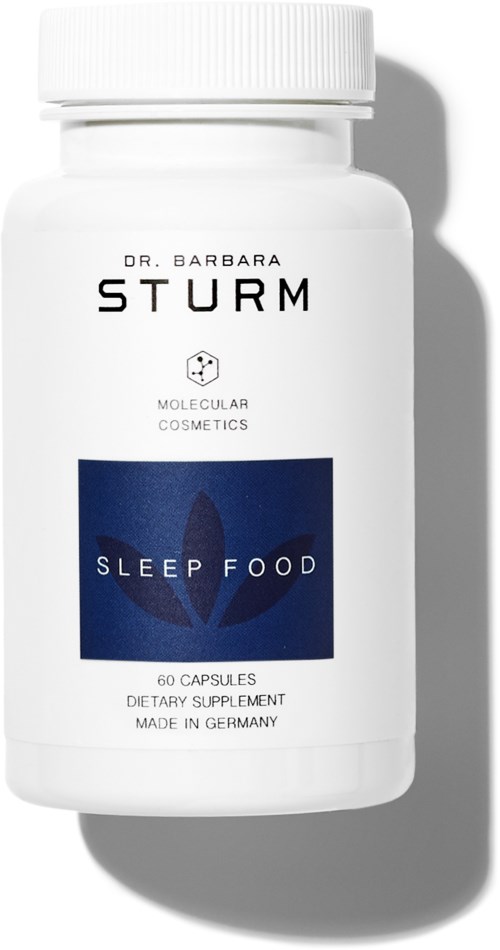 Vit flaska märkt 'Sleep Food' av Dr. Barbara Sturm, med 60 kapslar, tillverkad i Tyskland, för kosttillskott för sömn.