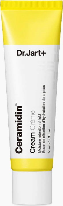 En vit tub med gul lock och etikett, innehållande Dr. Jart+ Ceramidin Cream för hudens fukt. 