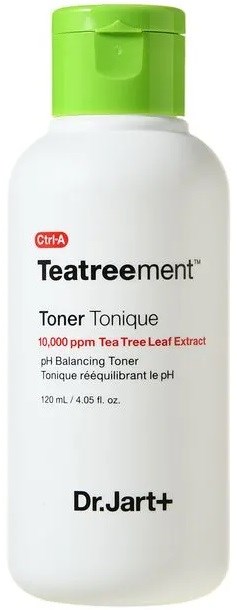 En vit flaska med grönt lock, etiketten anger att det är en toner med teträdsextrakt för att balansera pH.