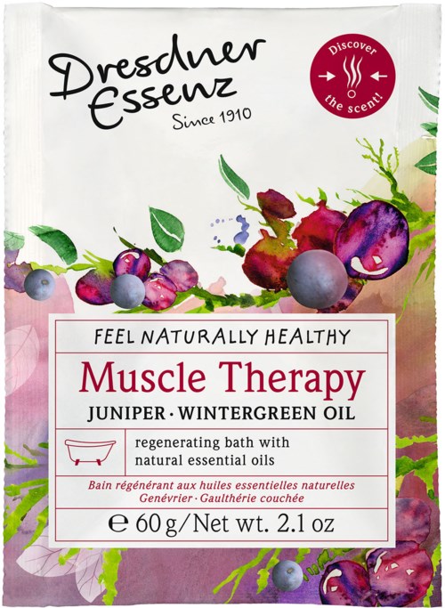 Weiße Badezusatzverpackung mit bunten Beeren, beschriftet 'Muscle Therapy' mit natürlichen Ölen und Kräutern.