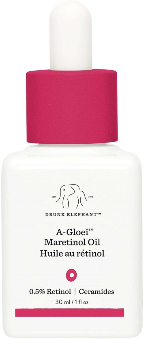 En vit flaska med rosa lock innehåller retinololja från Drunk Elephant, för hudvård och anti-aging.