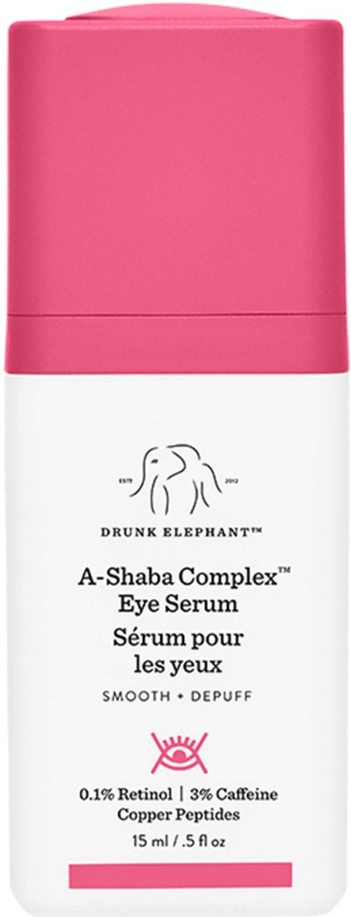 Ljus rosa flaska med ögonserum med elefantlogo, märkt Drunk Elephant, innehåller retinol och koffein.
