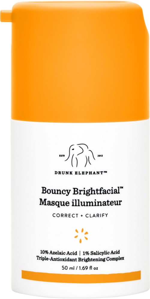 A skincare product in a white bottle with orange cap, labeled Drunk Elephant Bouncy Brightfacial.