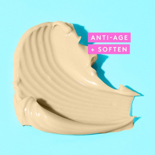 En kremet, beige hudpleieprodukt formet som en bølge på blå bakgrunn med rosa og hvit tekst.