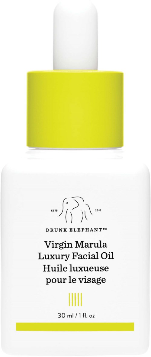 En hvit flaske med gul hette og pipette, merket Virgin Marula luksuriøs ansiktsolje, 30 ml.