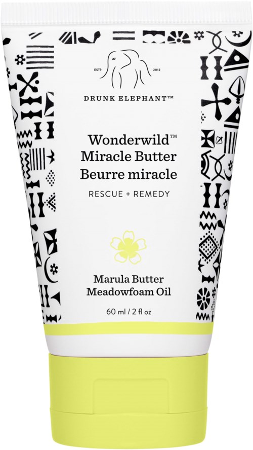 En vit och gul tub med Wonderwild Miracle Butter med svart mönster, märkt för räddning och botemedel, innehåller meadowfoamolja.