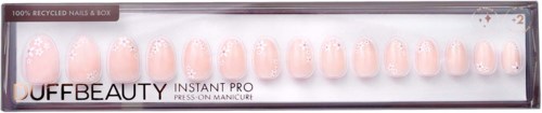 Box of 12 pale pink press-on nails with glitter, labeled as eco-friendly and quick to apply.